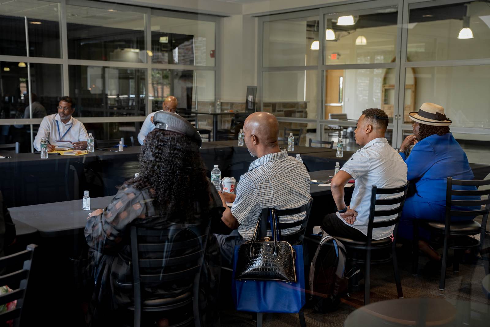 Apostolic church members sitting at a table.